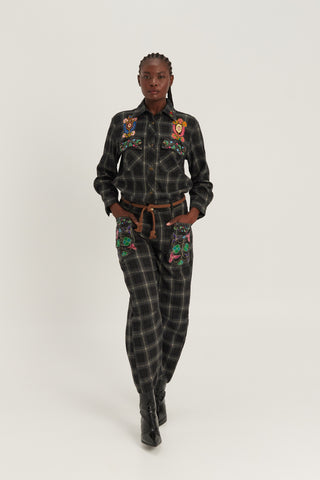 Woman wearing ME369 Heritage plaid shirt with colorful floral embroidery