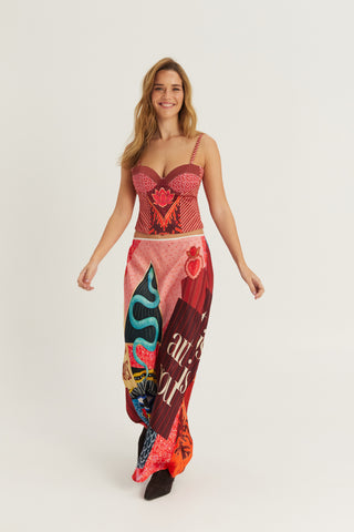 Woman wearing a colorful printed corset top with adjustable straps and a structured silhouette by ME369.