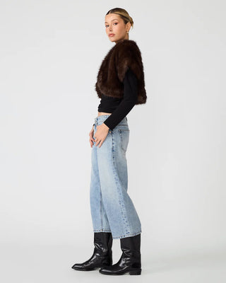 side view of woman wearing fur balero 