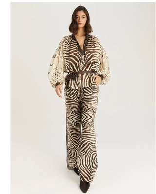 Full-length view of ME369 Rona zebra print shirt with coordinating pants