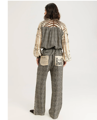 Back view of ME369 Bailey pants with grid print and patch pockets