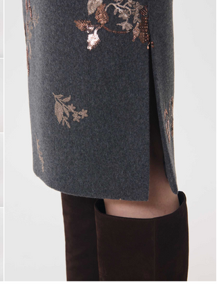 Side view of Jacob midi skirt showing the wrap-effect detail and slit